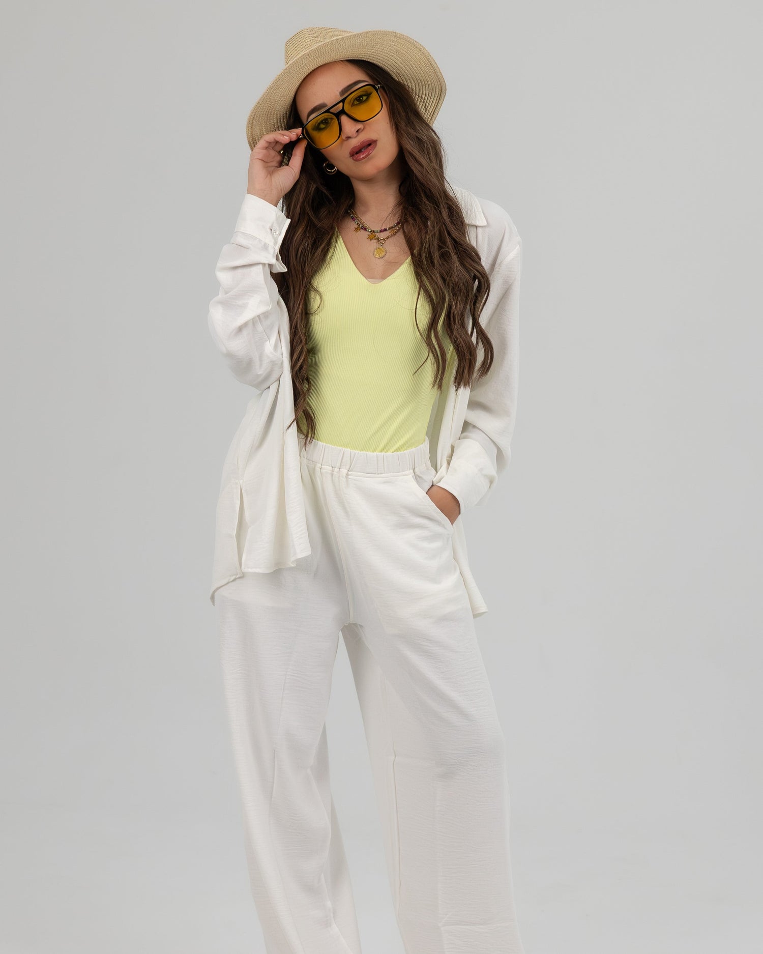 Woman wearing casual chic outfit from the For Her collection, showcasing summer-ready Egyptian cotton.